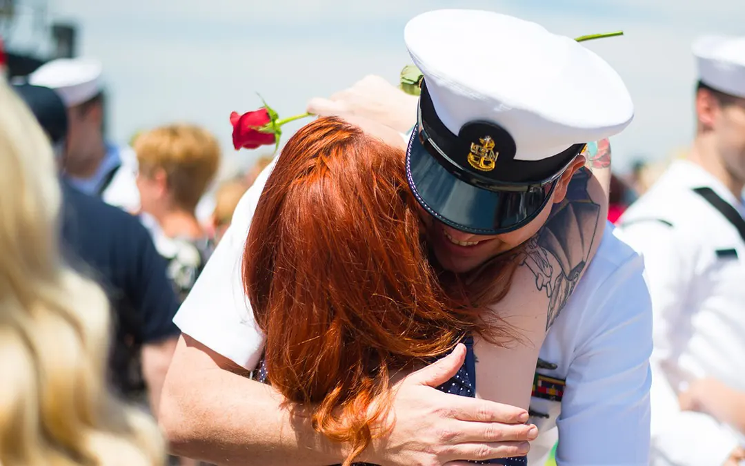 VA Loan sailor hugging wife